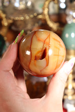 Load image into Gallery viewer, Carnelian Sphere with Druzy Cave