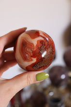 Load image into Gallery viewer, Mossy Strawberry Carnelian Sphere