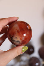 Load image into Gallery viewer, Strawberry-Toned Toasty Carnelian Sphere with Mossy Inclusions