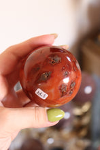 Load image into Gallery viewer, Mossy Strawberry Carnelian Sphere
