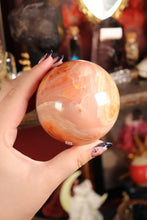 Load image into Gallery viewer, Peachy Carnelian Sphere with Natural Cave