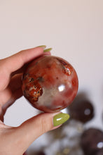 Load image into Gallery viewer, Strawberry-Toned Toasty Carnelian Sphere with Mossy Inclusions