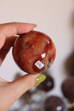 Load image into Gallery viewer, Strawberry-Toned Toasty Carnelian Sphere with Mossy Inclusions