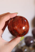 Load image into Gallery viewer, Mossy Strawberry Carnelian Sphere