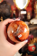 Load image into Gallery viewer, Peachy Carnelian Sphere with Natural Cave