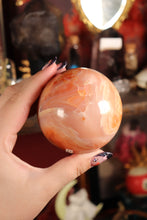 Load image into Gallery viewer, Peachy Carnelian Sphere with Natural Cave