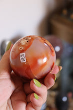 Load image into Gallery viewer, Cool-Toned Pink Carnelian Sphere with Quartz