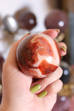 Load image into Gallery viewer, Mossy Strawberry Carnelian Sphere